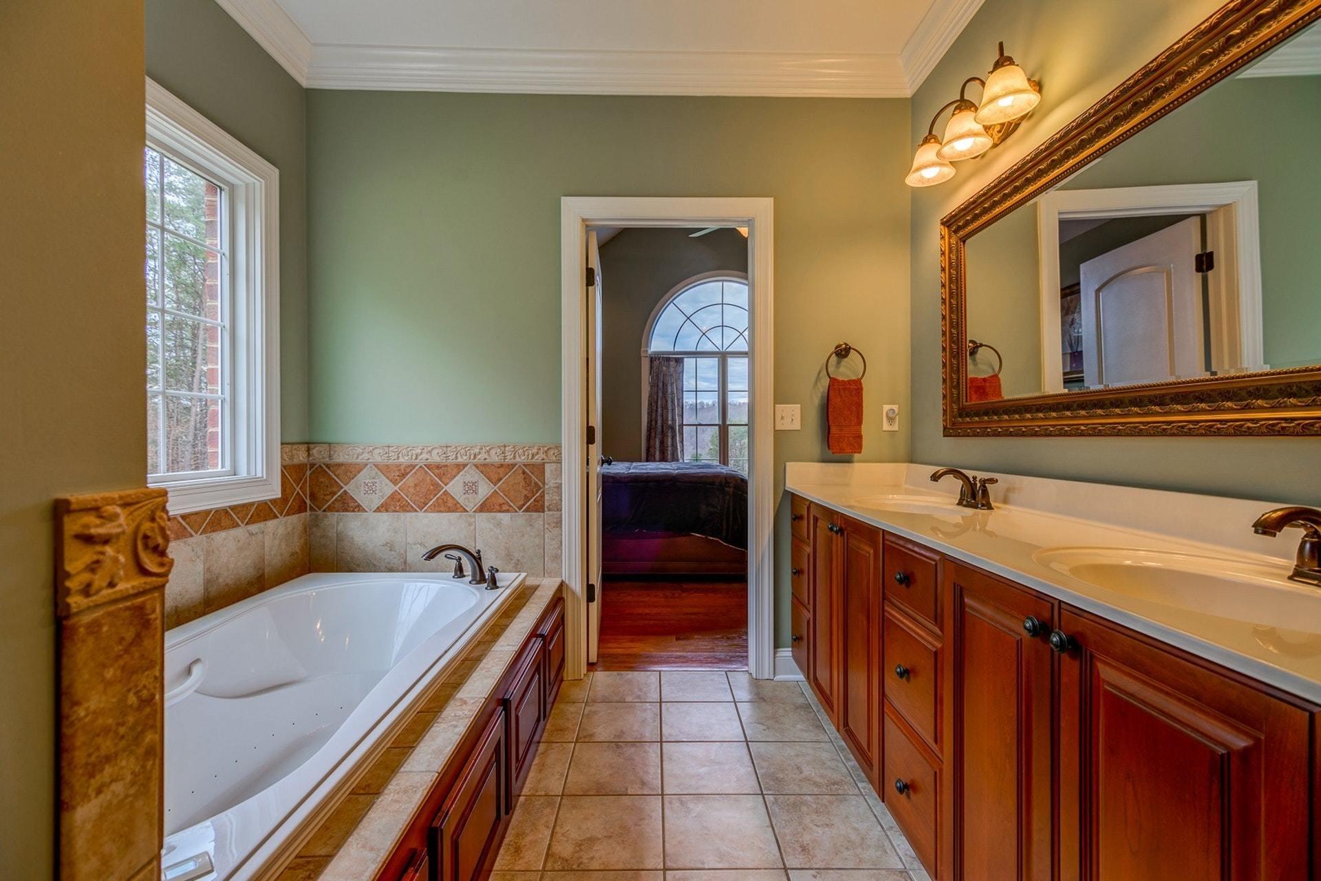565 Charlie Road Hardy, VA 24101 - Photo 26 of 58 a en suite bathroom with a granite countertop sink and a large mirror