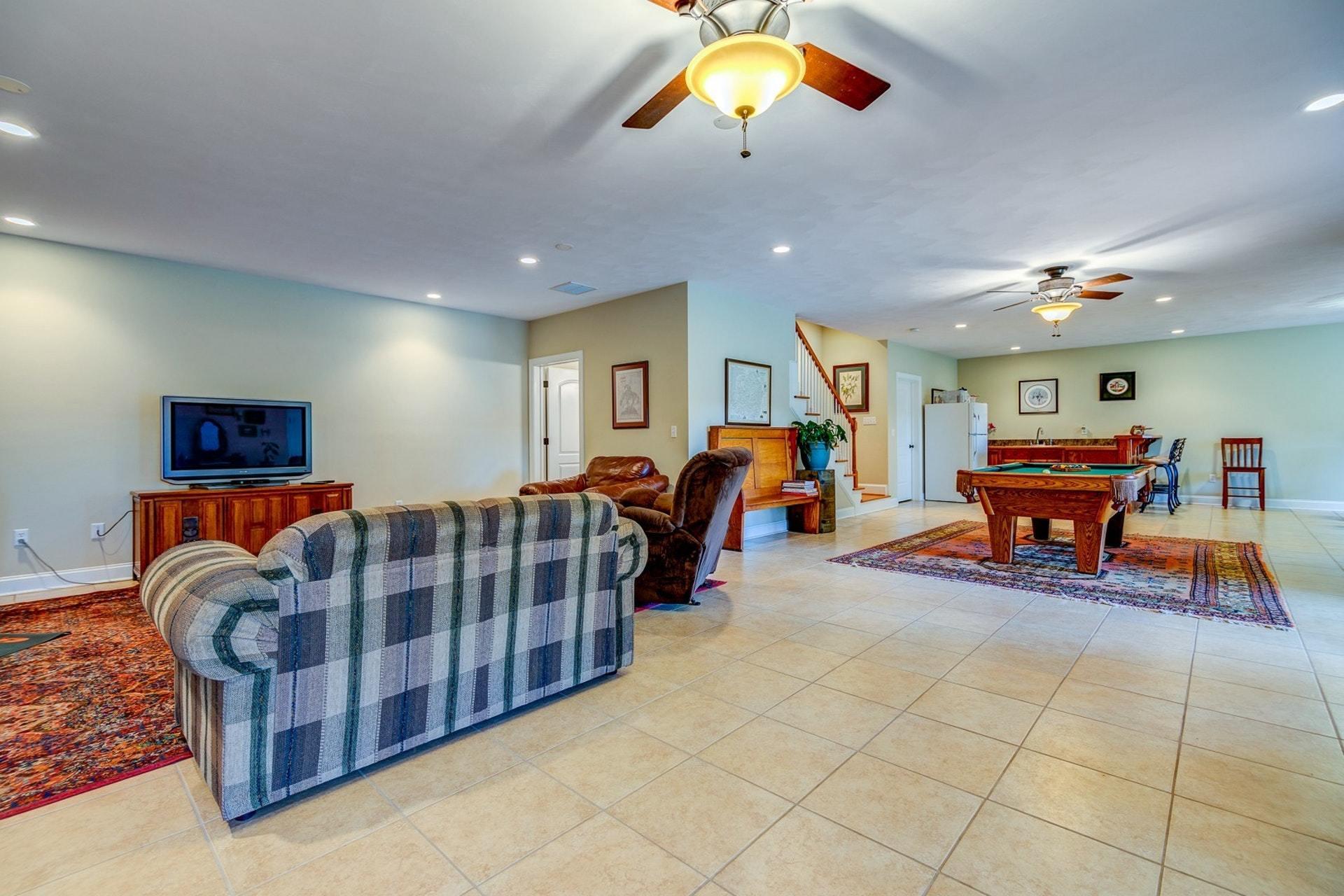 565 Charlie Road Hardy, VA 24101 - Photo 27 of 58 a living room with furniture and a flat screen tv