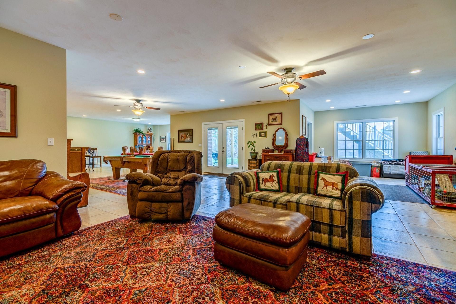 565 Charlie Road Hardy, VA 24101 - Photo 28 of 58 a living room with furniture a ceiling fan and a rug