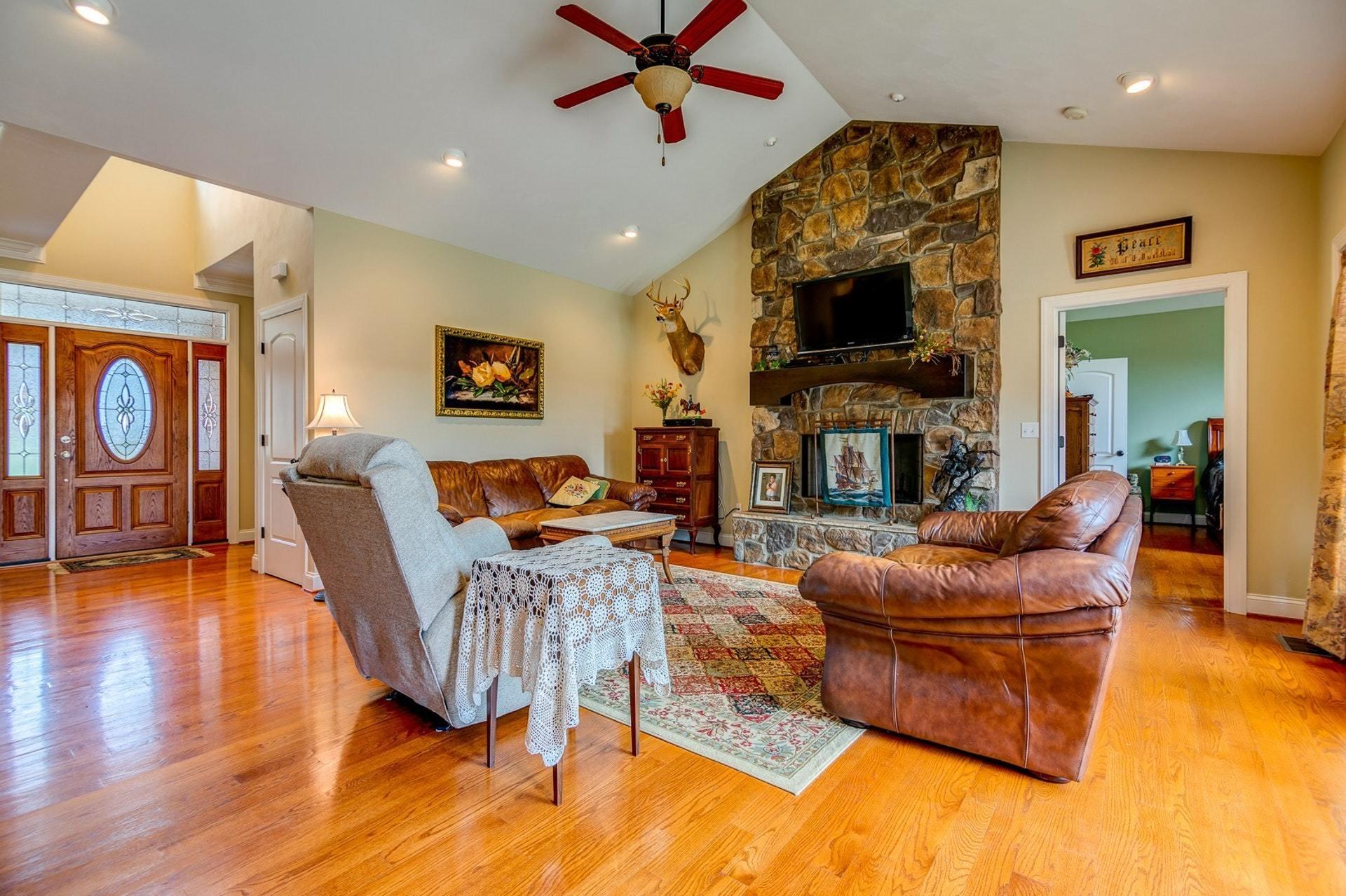 565 Charlie Road Hardy, VA 24101 - Photo 4 of 58 a living room with fireplace furniture and a flat screen tv
