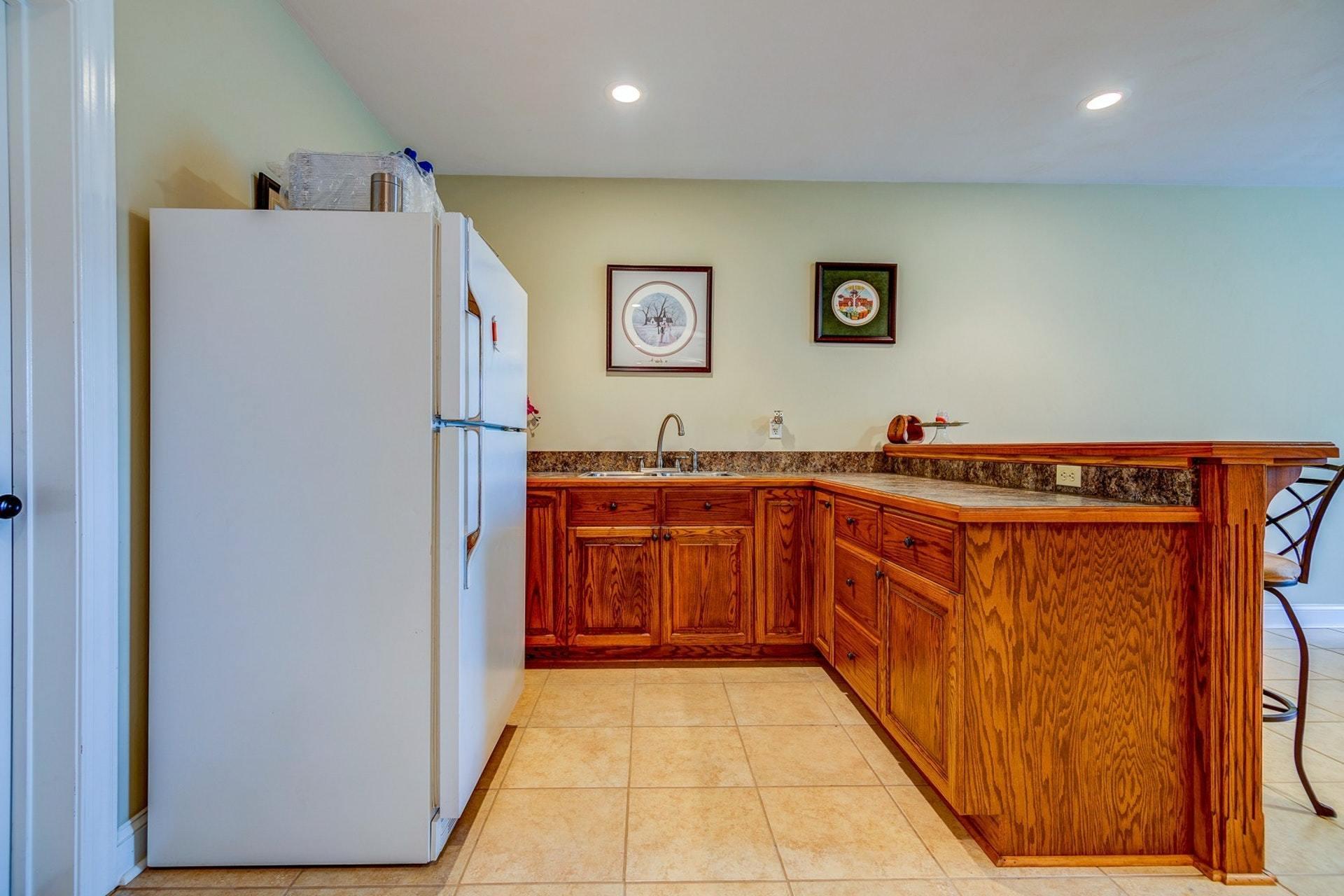 565 Charlie Road Hardy, VA 24101 - Photo 29 of 58 a kitchen with stainless steel appliances a refrigerator and a stove