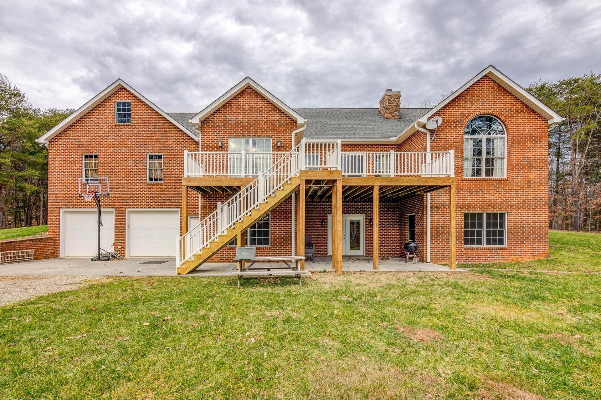 565 Charlie Road Hardy, VA 24101 - Photo 33 of 58 front view of a house with a yard