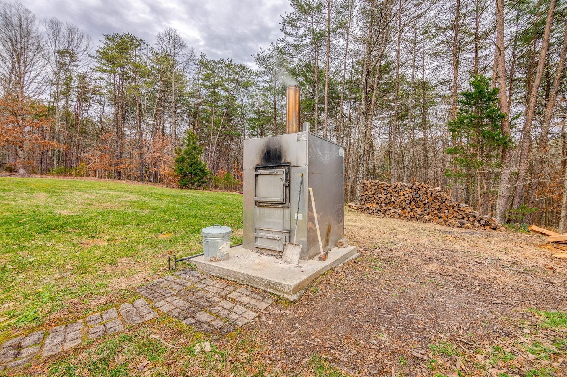 565 Charlie Road Hardy, VA 24101 - Photo 38 of 58 a view of a backyard with large trees