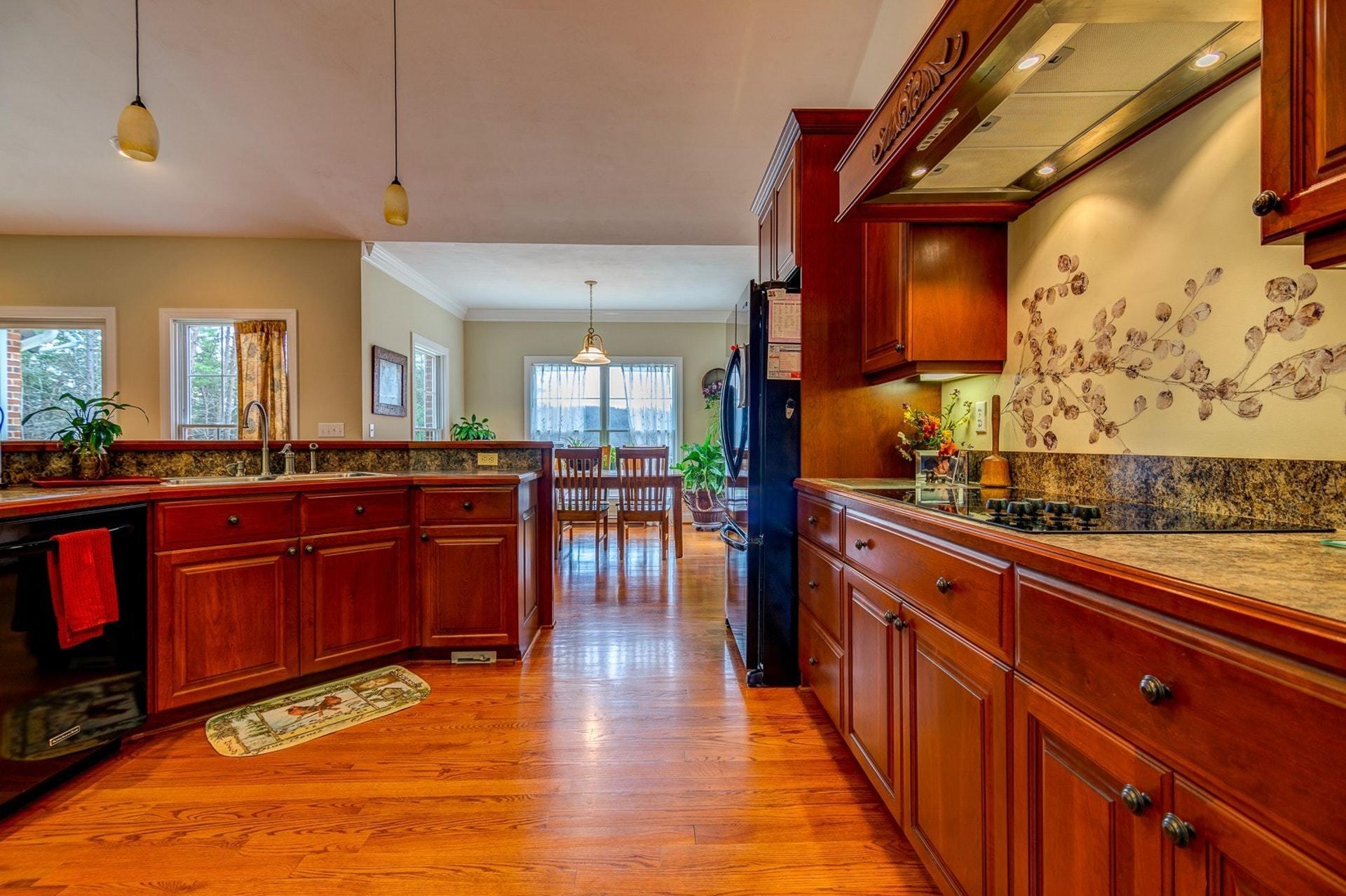 565 Charlie Road Hardy, VA 24101 - Photo 5 of 58 a view of a kitchen with lots of counter top space and wooden floor
