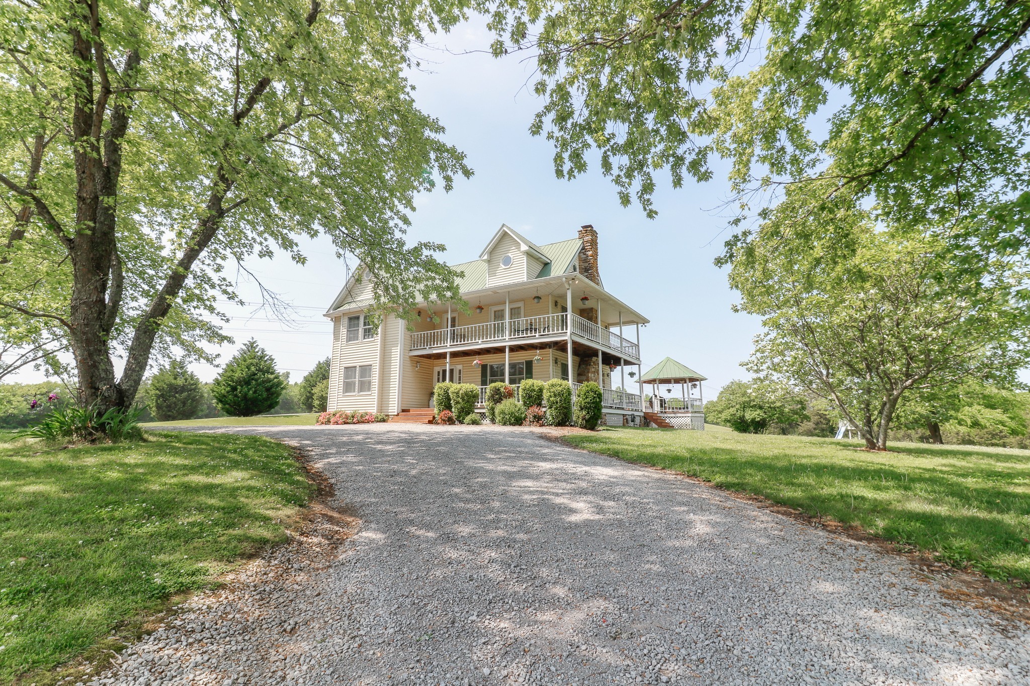 9801 Central Pike Mount Juliet, TN 37122 - Photo 1 of 42 a front view of a house with a yard and trees