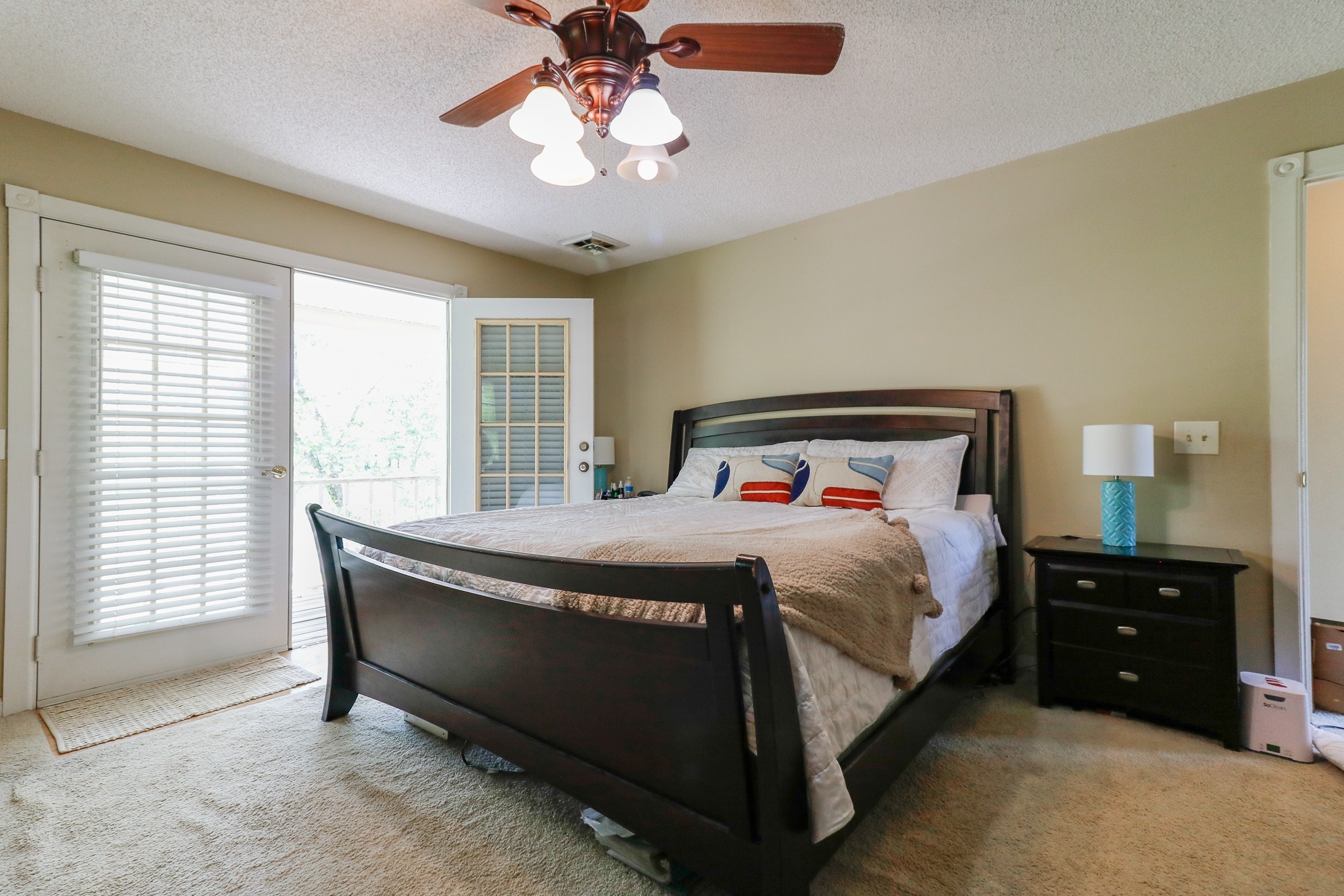 9801 Central Pike Mount Juliet, TN 37122 - Photo 18 of 42 a bedroom with a bed and a chandelier