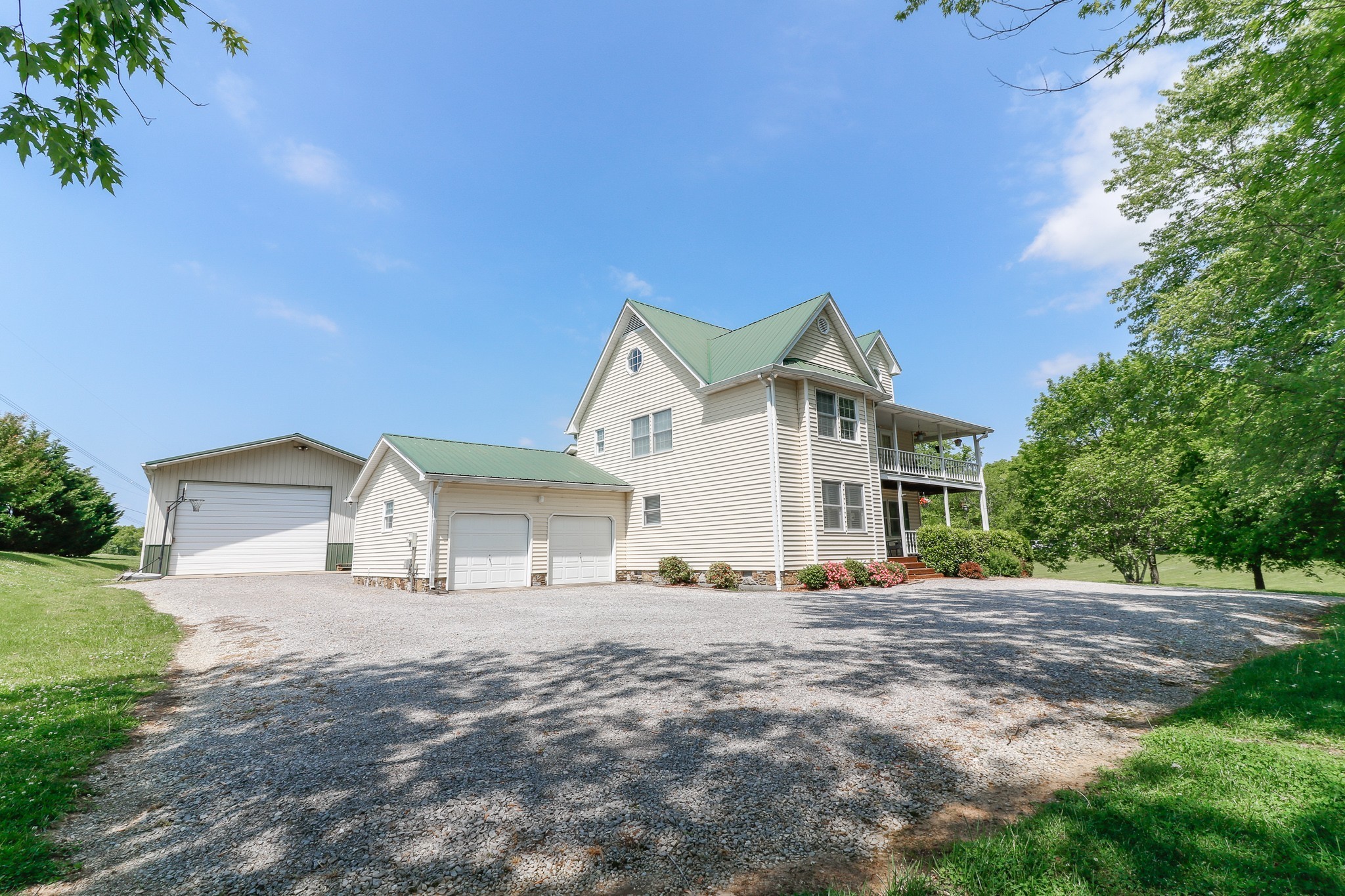 9801 Central Pike Mount Juliet, TN 37122 - Photo 2 of 42 a front view of a house with a yard and trees