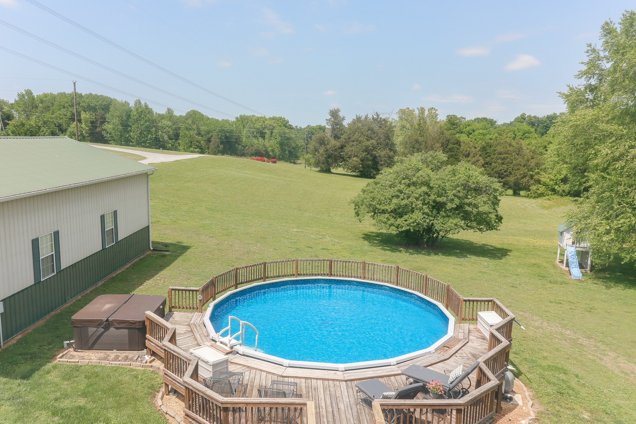 9801 Central Pike Mount Juliet, TN 37122 - Photo 28 of 42 a view of a swimming pool and trees in the background