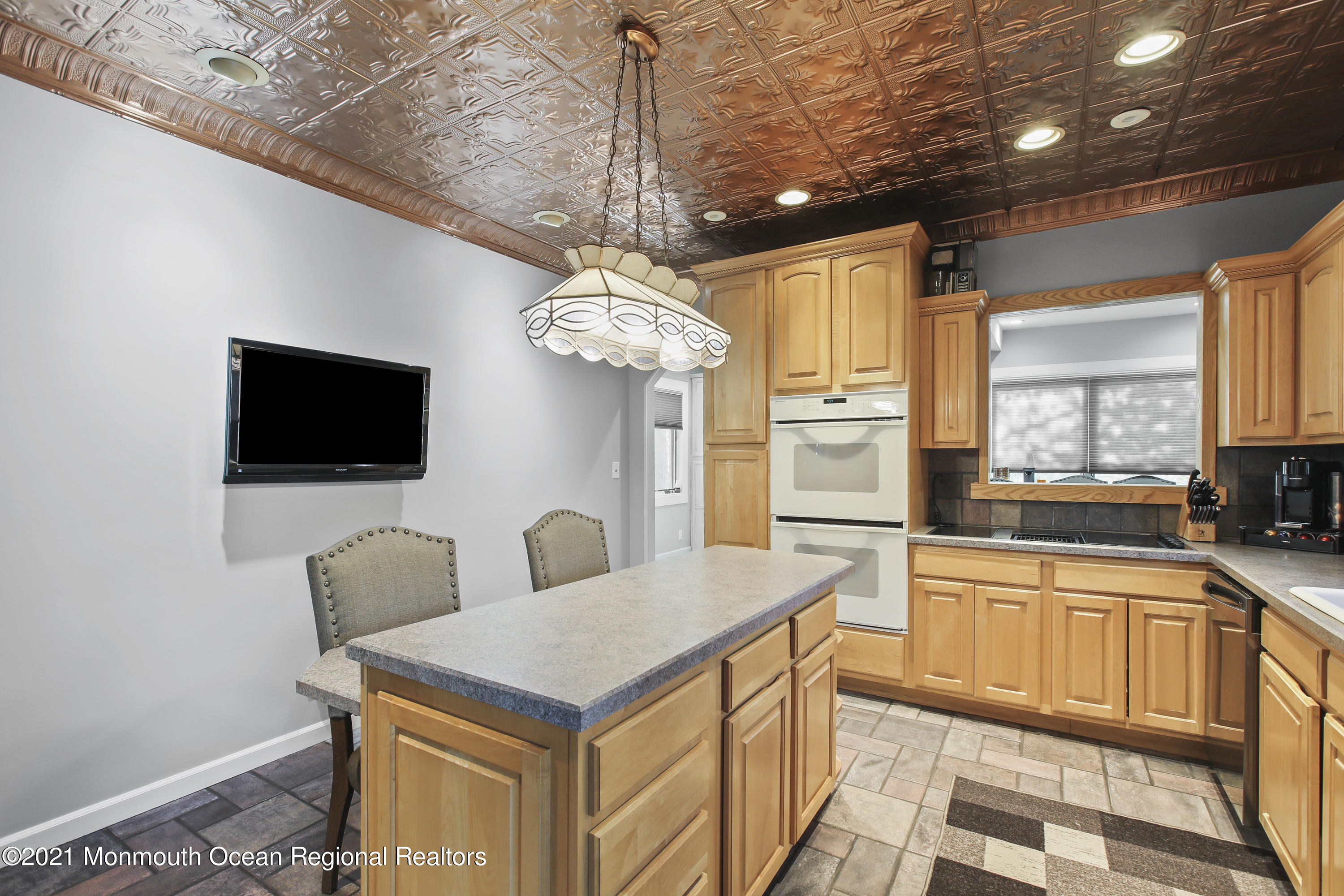 450 North County Line Road Jackson, NJ 08527 - Photo 12 of 35 a open kitchen with stainless steel appliances granite countertop a sink dishwasher a dining table and chairs with wooden floor