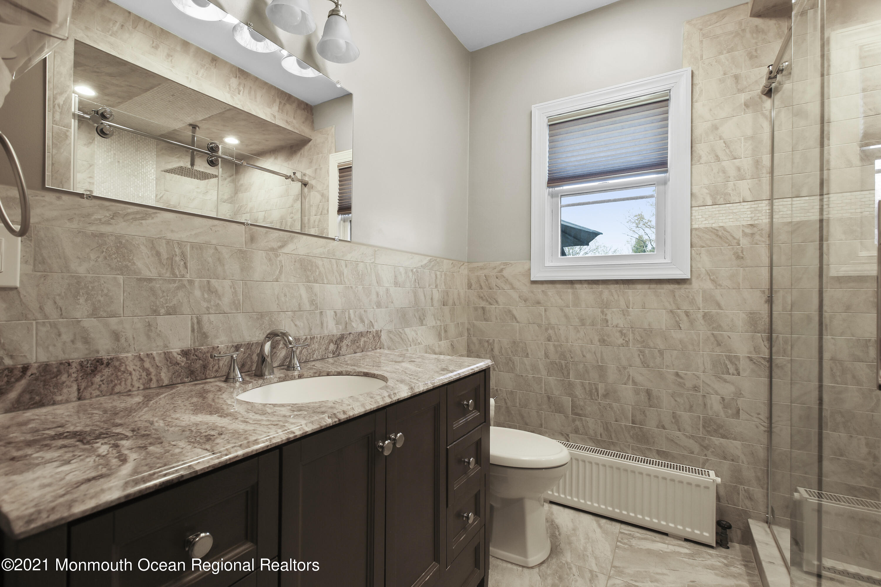 450 North County Line Road Jackson, NJ 08527 - Photo 14 of 35 a bathroom with a granite countertop sink toilet and shower