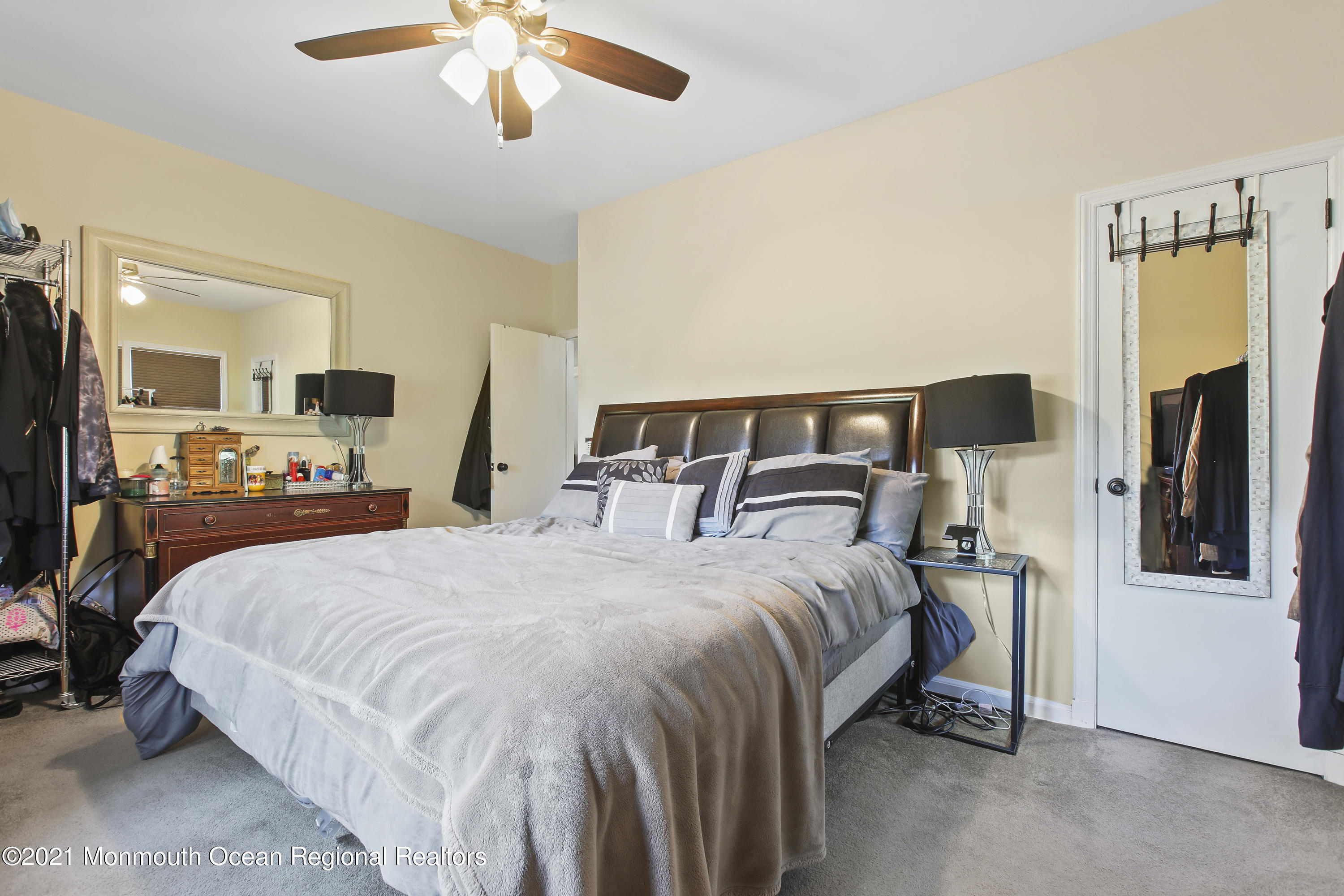 450 North County Line Road Jackson, NJ 08527 - Photo 17 of 35 a large bed sitting in a bedroom and a chandelier