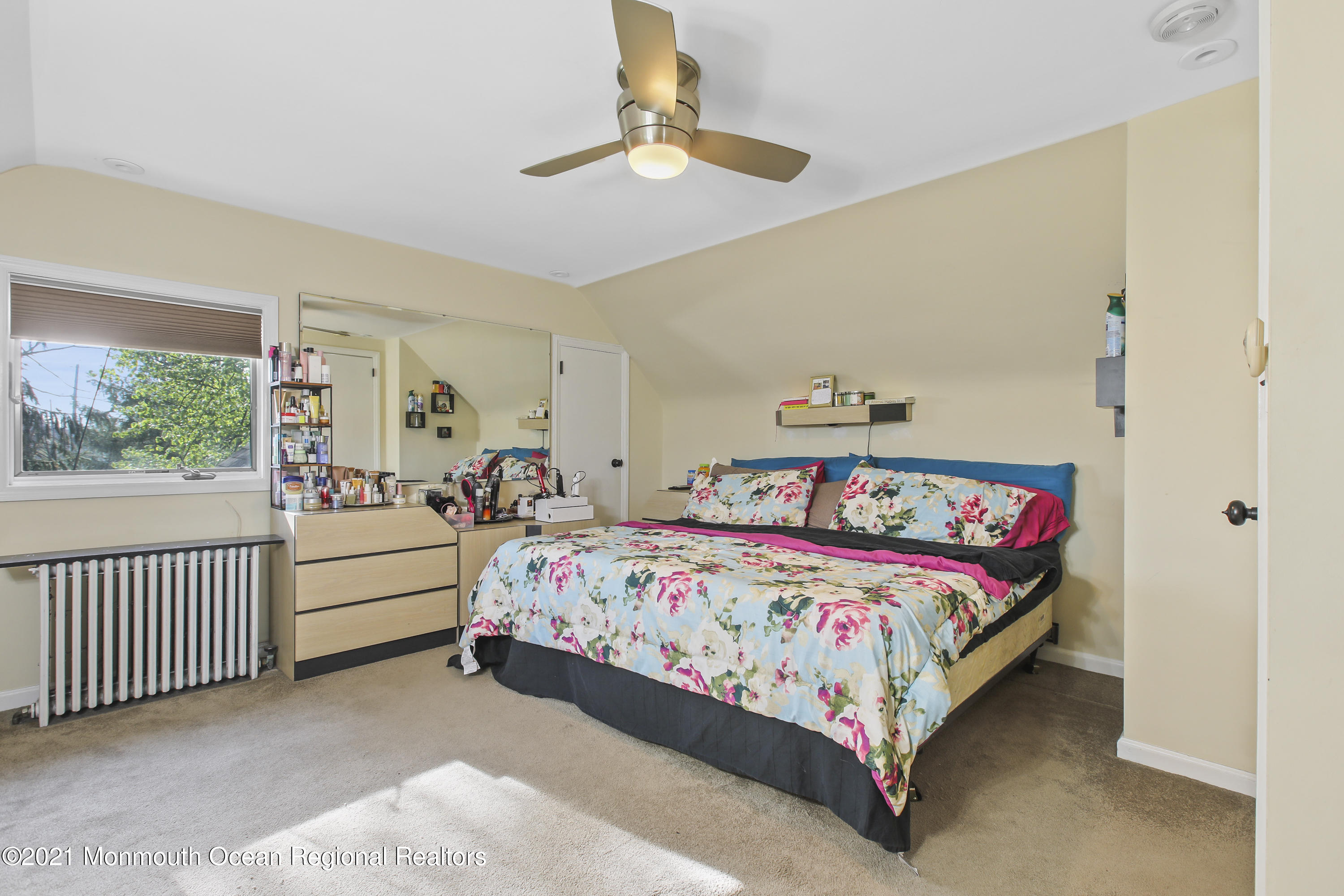 450 North County Line Road Jackson, NJ 08527 - Photo 19 of 35 a bedroom with a bed and a chandelier