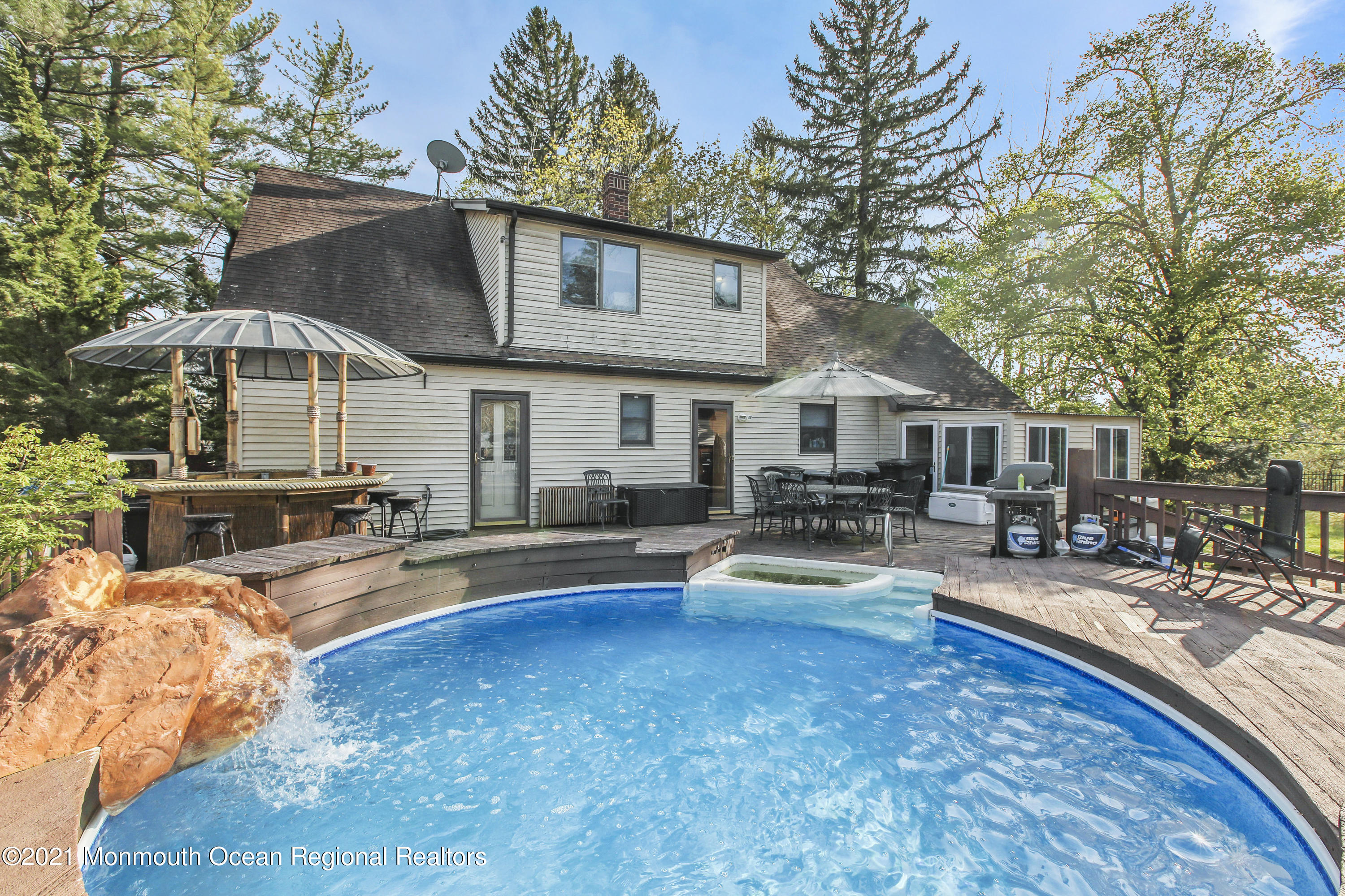 450 North County Line Road Jackson, NJ 08527 - Photo 27 of 35 a view of a house with swimming pool and sitting area