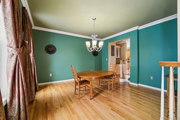 a view of a livingroom with furniture and wooden floor