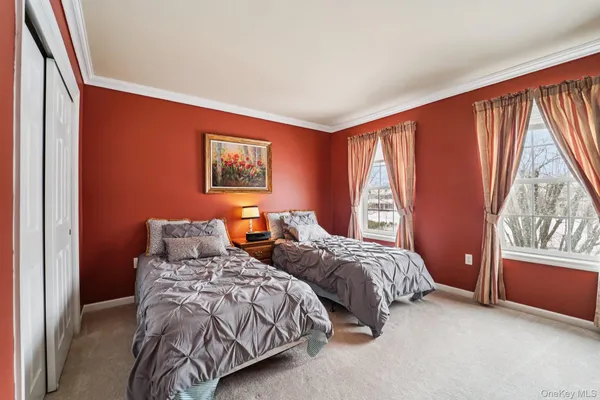 a spacious bathroom with a tub a sink and a shower