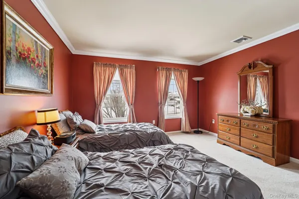 a front view of a residential apartment building with a yard