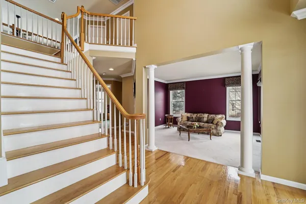 a bathroom with a toilet a sink and a mirror