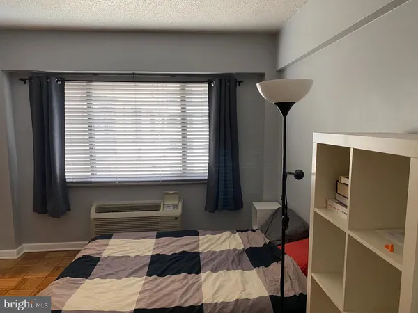 a view of a livingroom with furniture and a window