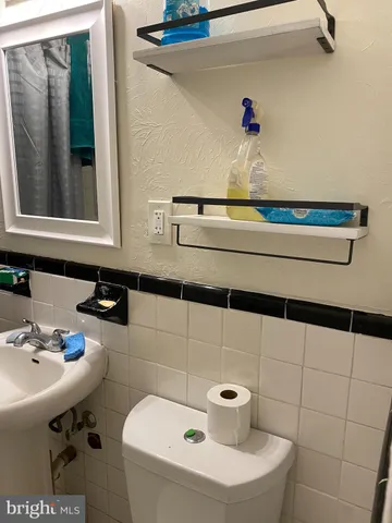 a bathroom with a sink and a window
