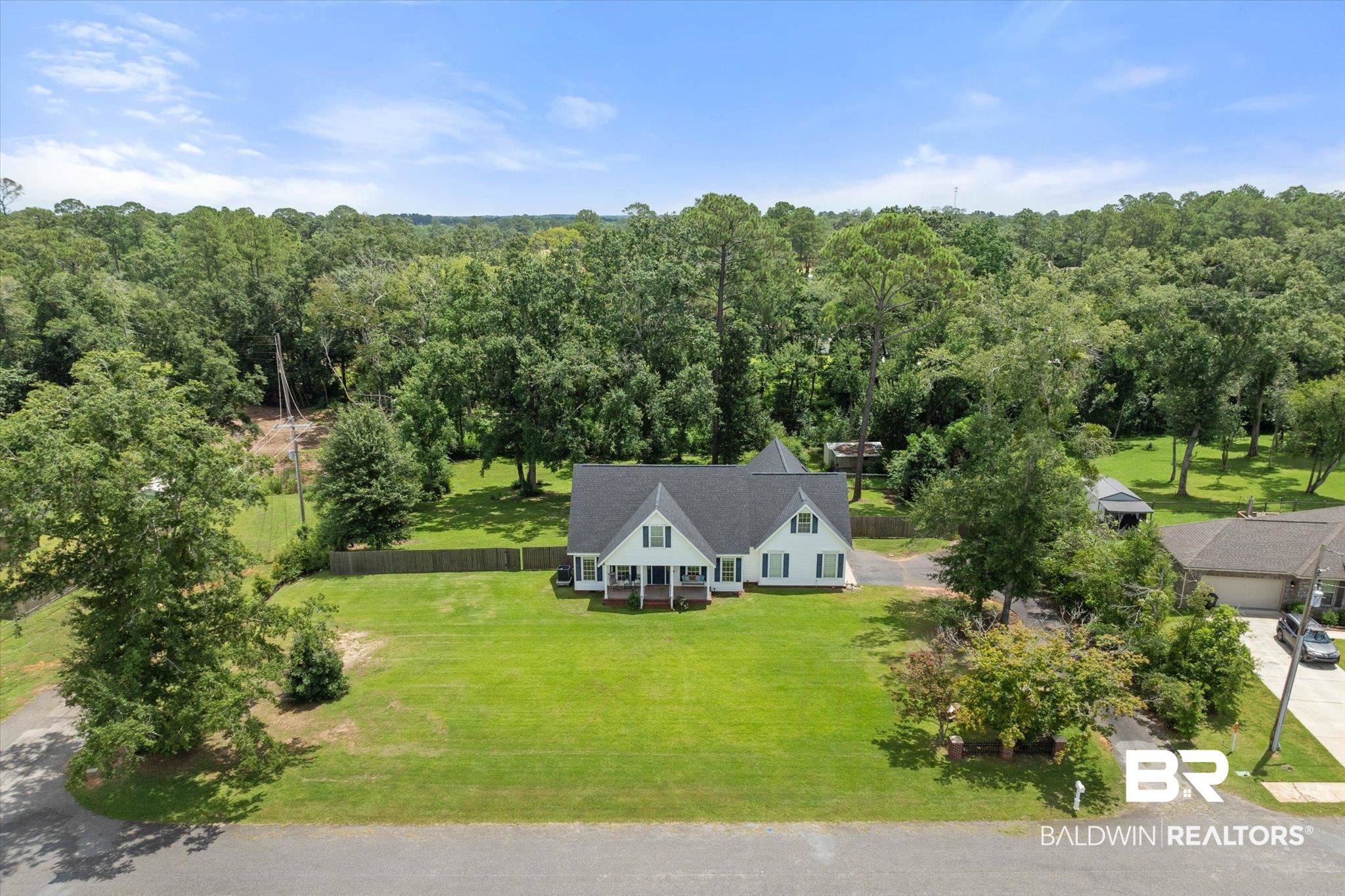 22760 Ridgewood Drive Robertsdale, AL 36567 - Photo 2 of 44 View of subject property with a forest
