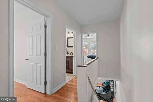 an entryway with wooden floor and stairs