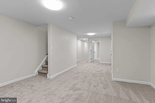 an empty room with white walls and white door