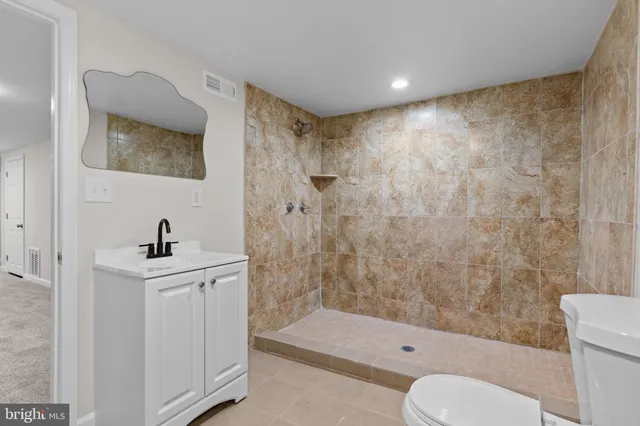 a utility room with multiple dryer and washer