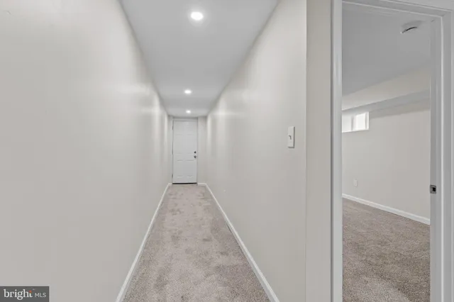 a view of a brick house with many windows