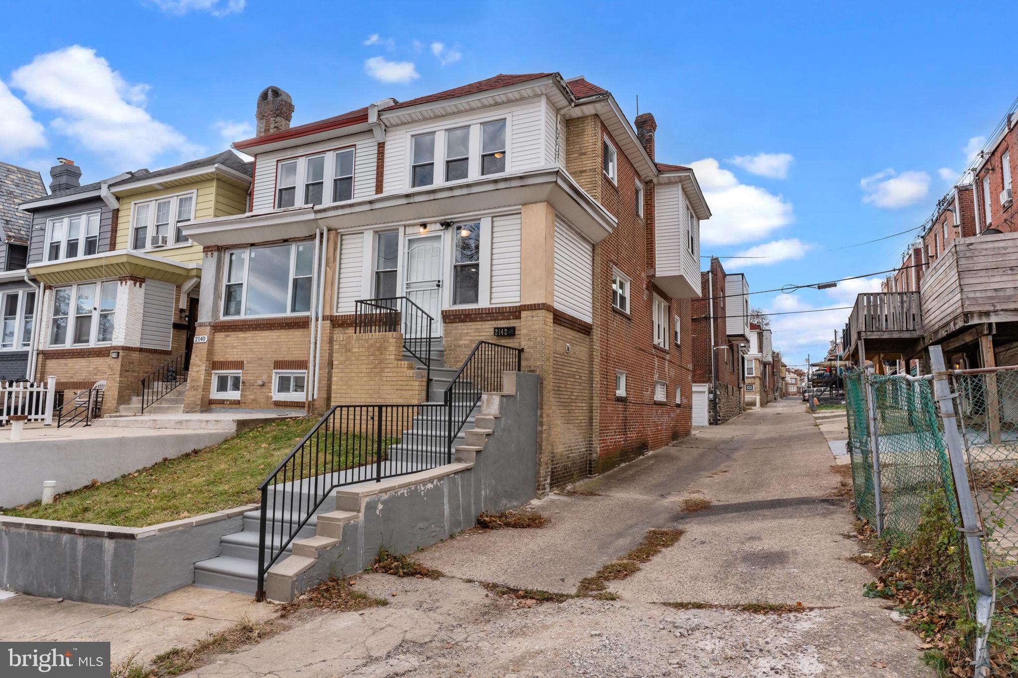 2142 North 58th Street Philadelphia, PA 19131 - Photo 31 of 36 a view of a brick house with many windows