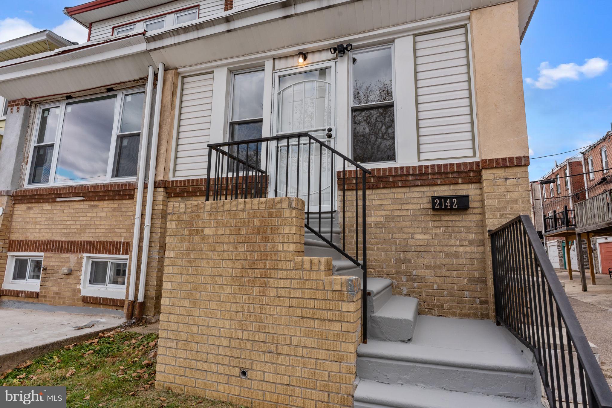 2142 North 58th Street Philadelphia, PA 19131 - Photo 32 of 36 a view of a brick house with many windows