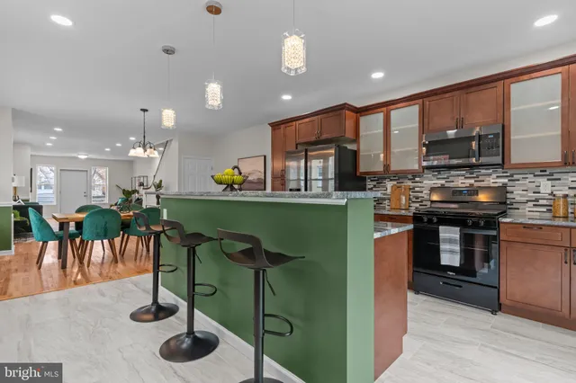 a kitchen with lots of counter space and furniture