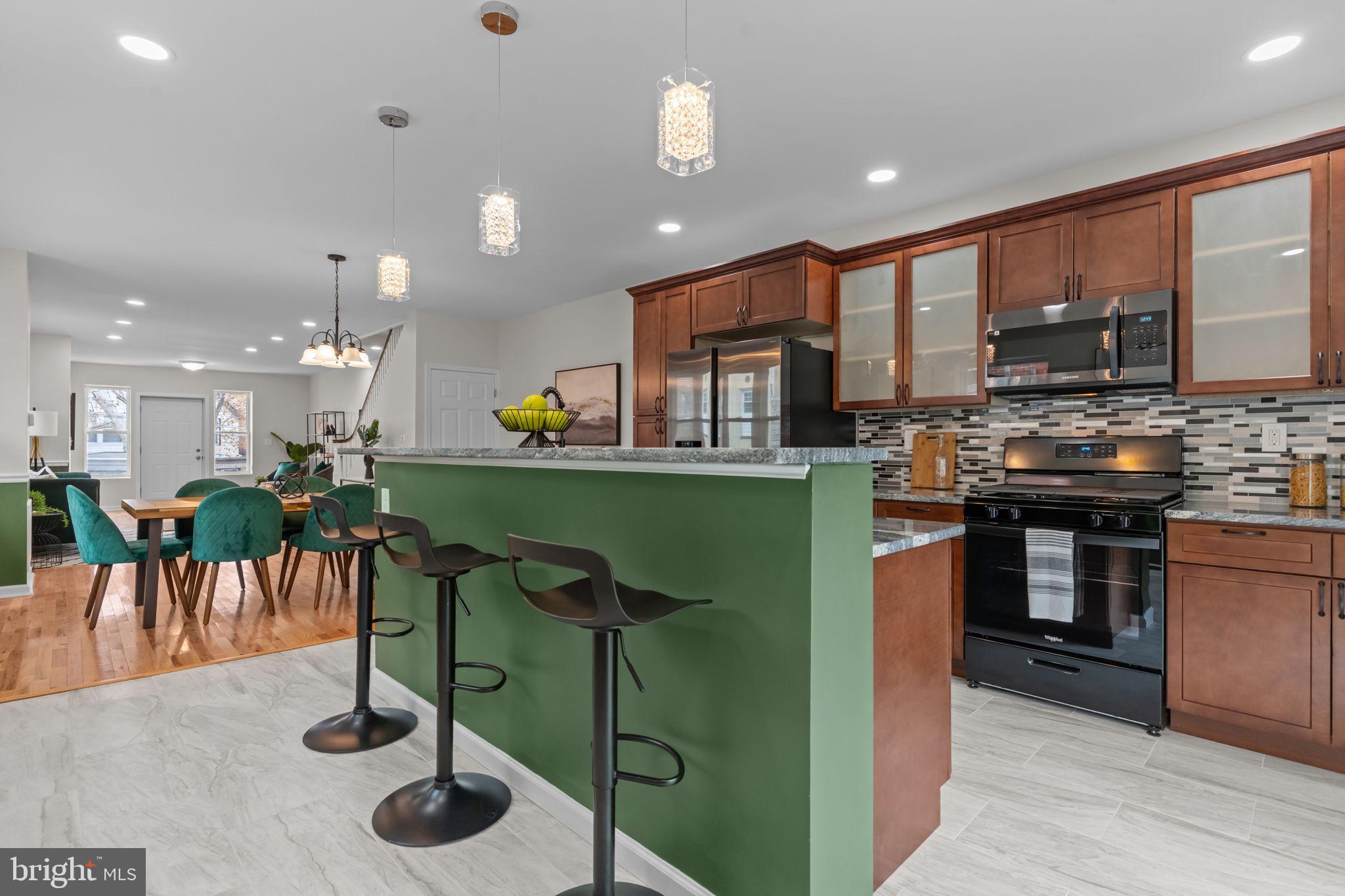 2142 North 58th Street Philadelphia, PA 19131 - Photo 10 of 36 a kitchen with lots of counter space and furniture