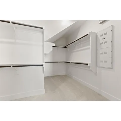 a picture of a room with a black white wall