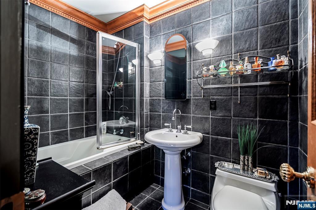 4 Horizon Road, Unit G10 Fort Lee, NJ 07024 - Photo 12 of 20 a bathroom with a sink toilet and shower