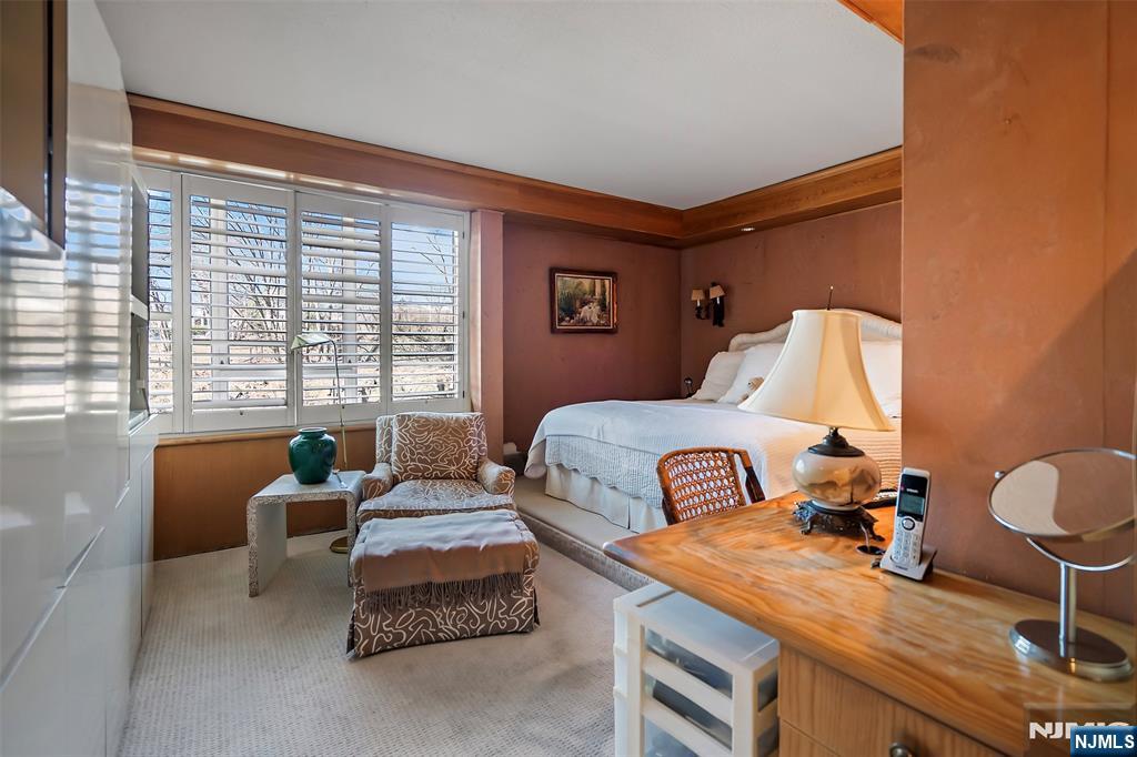 4 Horizon Road, Unit G10 Fort Lee, NJ 07024 - Photo 14 of 20 a bedroom with furniture and a window