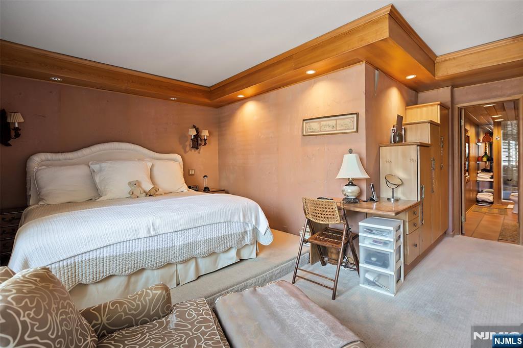 4 Horizon Road, Unit G10 Fort Lee, NJ 07024 - Photo 15 of 20 a bedroom with a bed and wooden floor