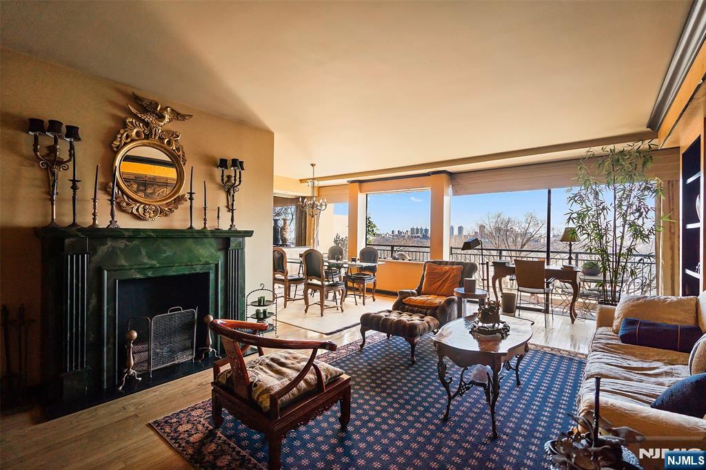4 Horizon Road, Unit G10 Fort Lee, NJ 07024 - Photo 9 of 20 a living room with fireplace furniture and a large window