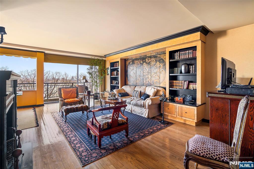4 Horizon Road, Unit G10 Fort Lee, NJ 07024 - Photo 10 of 20 a living room with furniture a rug and a large window