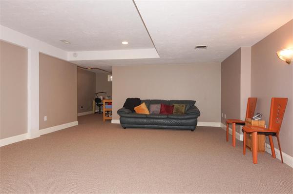 6 Preservation Way Medfield, MA 02052 - Photo 24 of 30 a living room with furniture and a chair