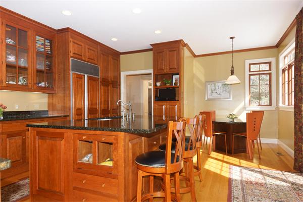 6 Preservation Way Medfield, MA 02052 - Photo 8 of 30 a kitchen with stainless steel appliances kitchen island granite countertop a table and chairs