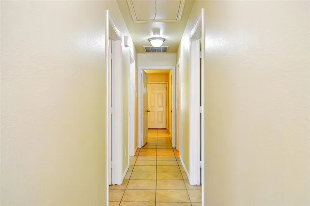 a view of storage and utility room with a window
