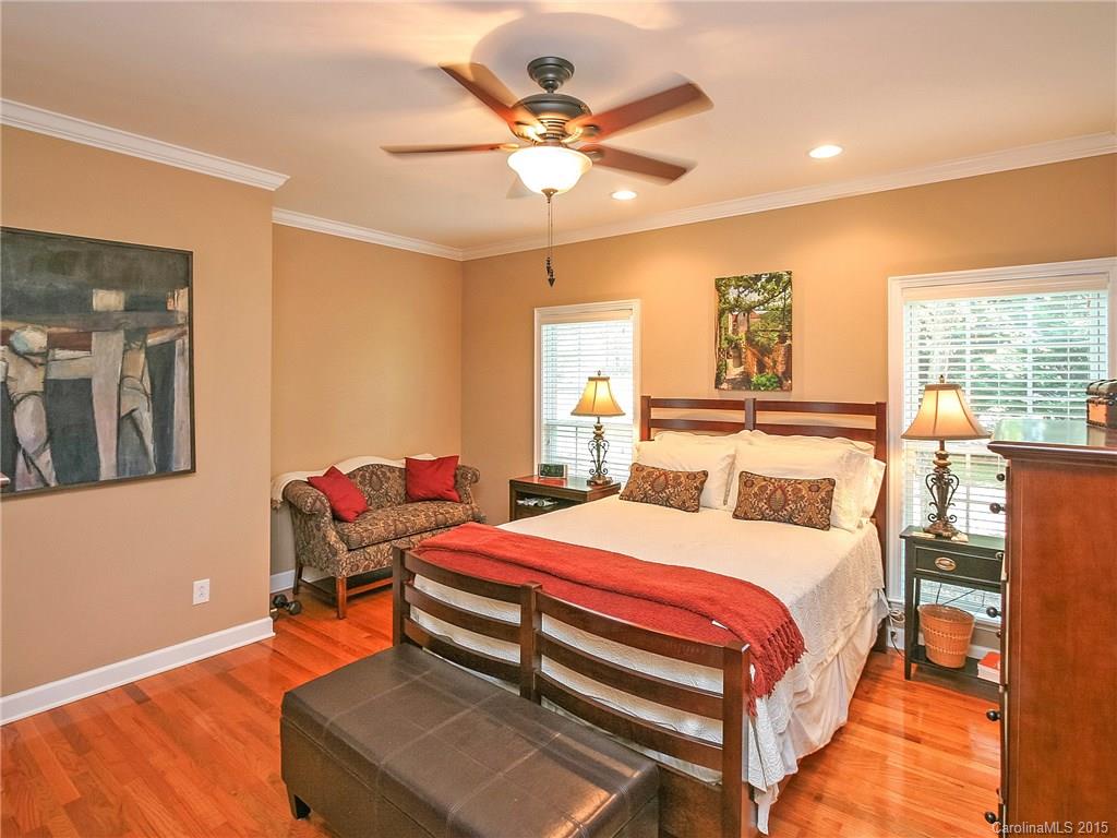 2819 Farmstead Lane Fort Mill, SC 29708 - Photo 15 of 24 a bedroom with a bed and wooden floor