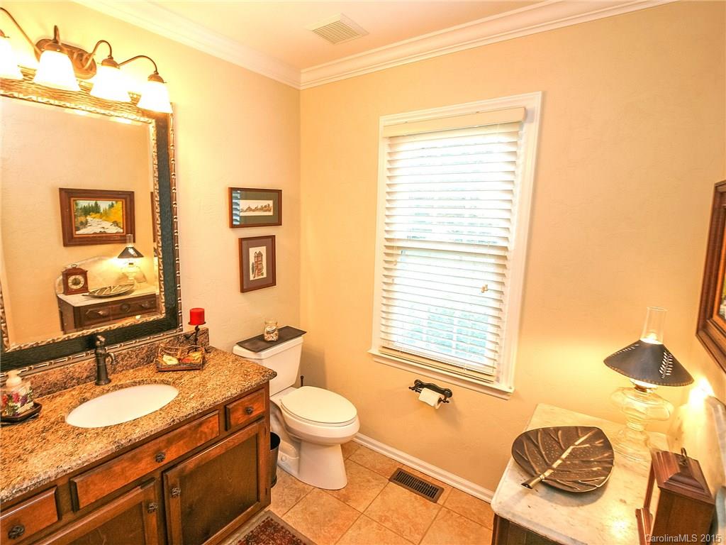2819 Farmstead Lane Fort Mill, SC 29708 - Photo 19 of 24 a bathroom with a granite countertop toilet sink and mirror