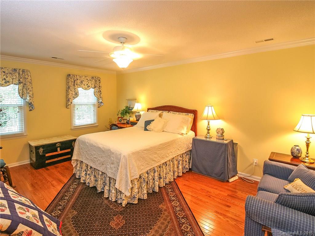 2819 Farmstead Lane Fort Mill, SC 29708 - Photo 20 of 24 a bedroom with a bed and wooden floor