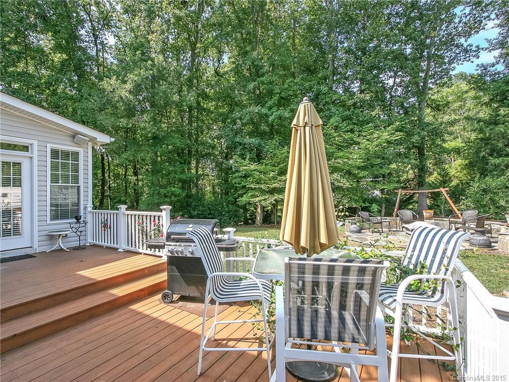 2819 Farmstead Lane Fort Mill, SC 29708 - Photo 3 of 24 a view of a deck with two chairs and a table