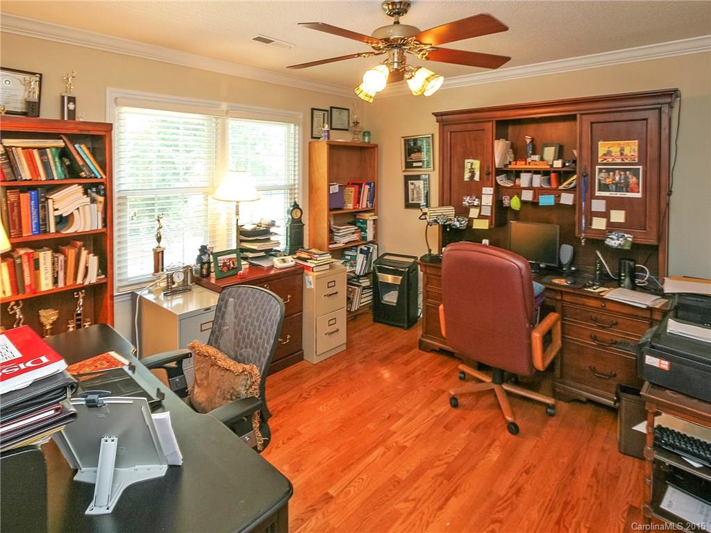 2819 Farmstead Lane Fort Mill, SC 29708 - Photo 22 of 24 a view of a workspace with furniture and a livingroom