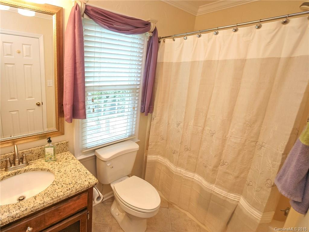 2819 Farmstead Lane Fort Mill, SC 29708 - Photo 24 of 24 a bathroom with a granite countertop sink toilet and shower