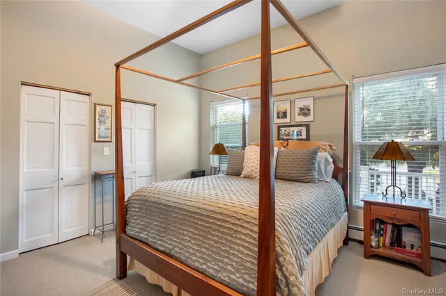 a bedroom with a bed and a balcony