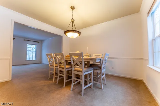 a view of a dining room and a chandelier