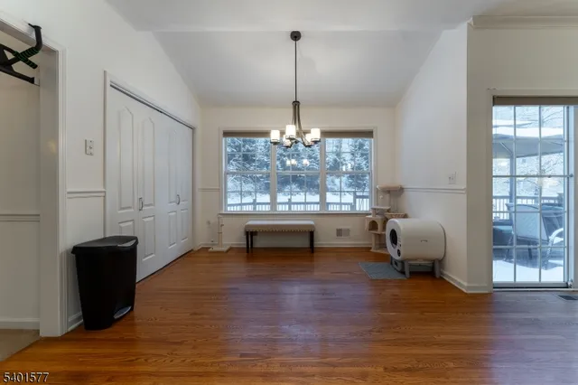 a living room with furniture window and wooden floor